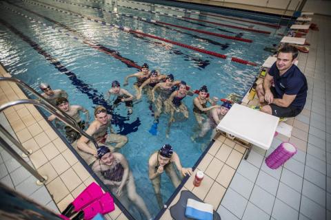 Swimming club and their teacher