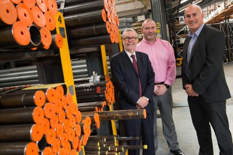 Men in warehouse looking at stock