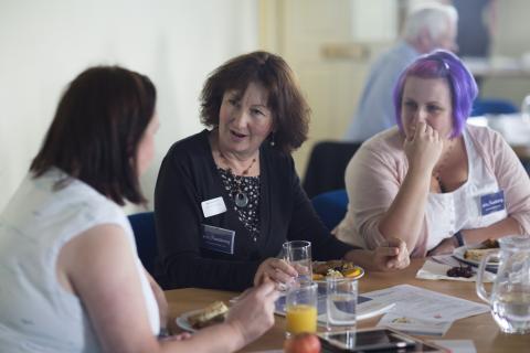 Women talking around a table