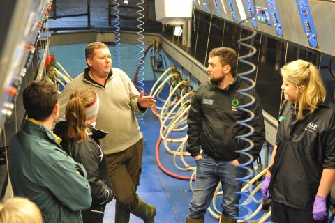 neil evans with farmers at sdct event