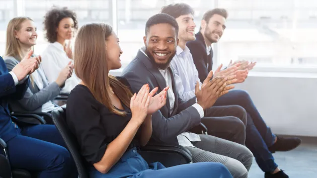 business conference - delegates applauding