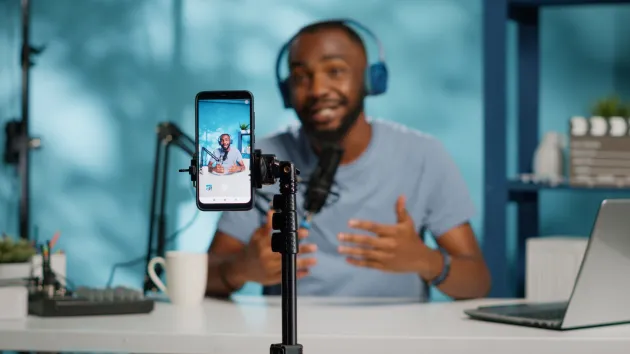Digital content creator using a mobile phone for filming