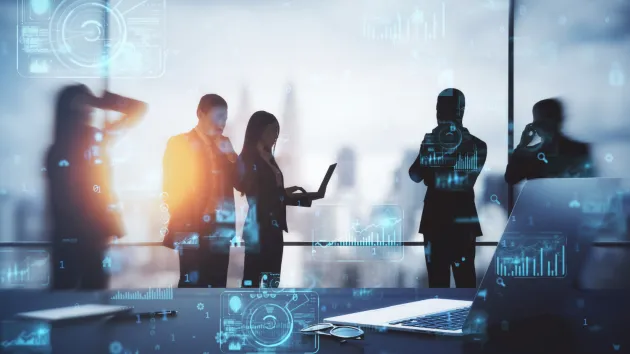 people, laptops, financial reports 