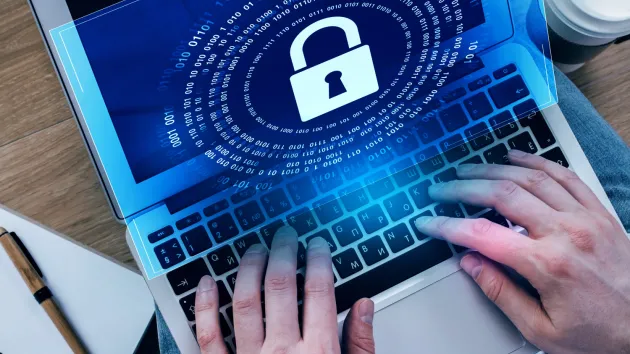 laptop with screen featuring digital padlock