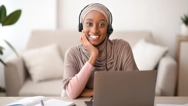 woman looking at a laptop