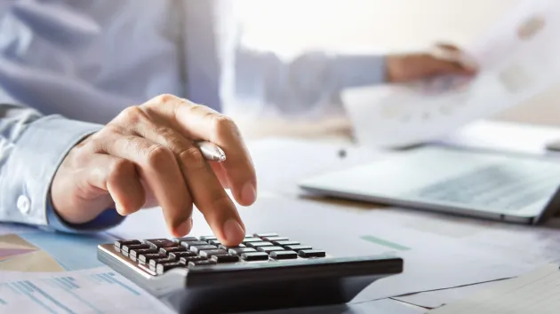 person using a calculator