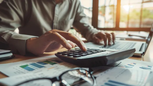 person using a calculator