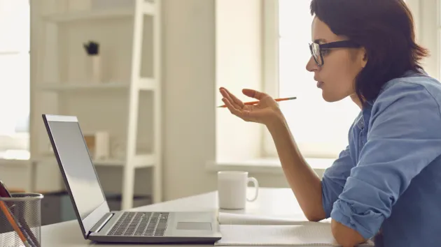 person using a laptop - online course