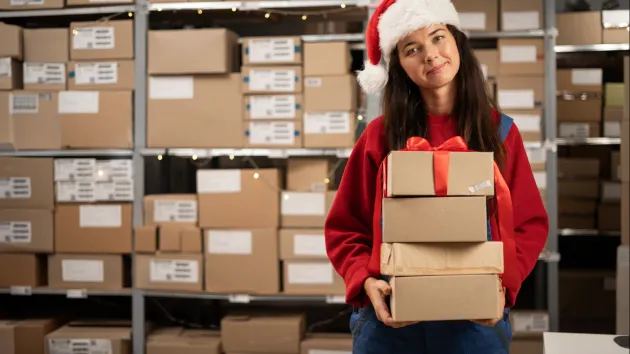 Warehouse worker wearing a Christmas hat 