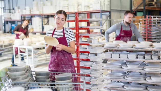 young person working in a ceramic factory 