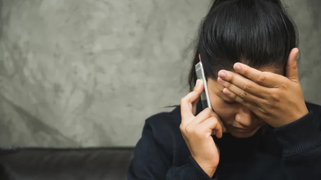 worried person on the phone 