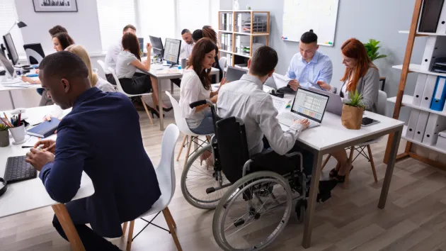 Office colleagues sitting around a table