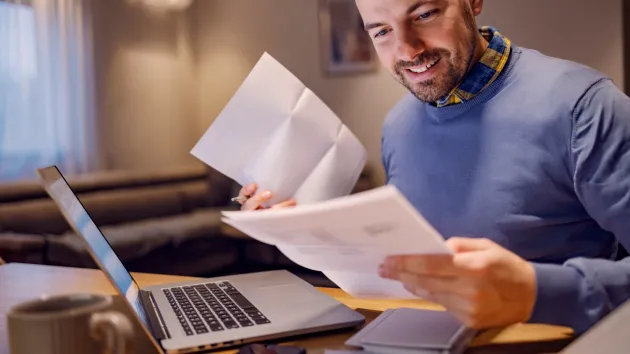 person reading a letter