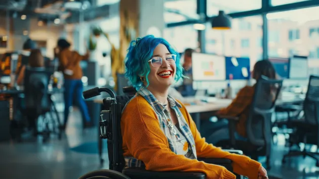 Wheelchair user working in an office
