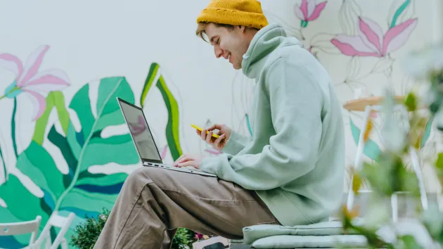 Young entrepreneur working on a laptop