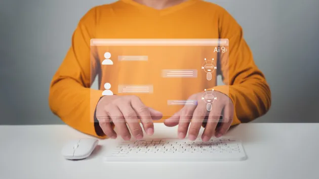 Business Intelligence tools - person using AI, laptop