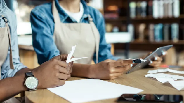 business owners looking at invoices