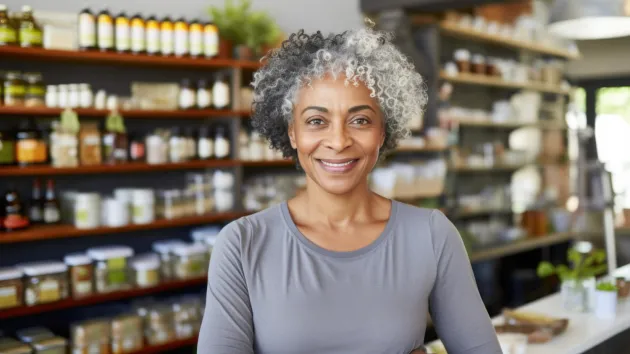 mature worker in health care shop