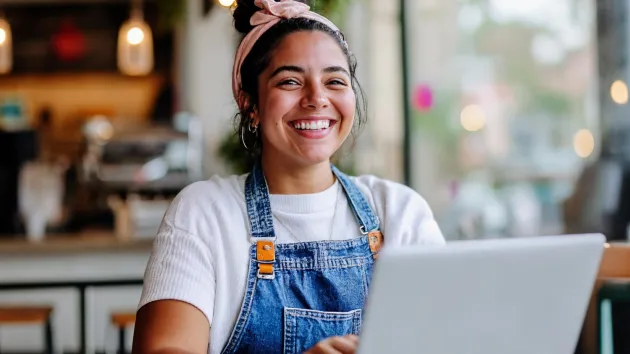 small business owner, florist, using a laptop
