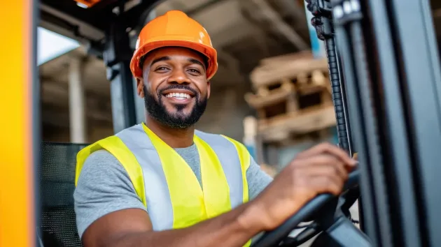 Warehouse worker driving a vehicle