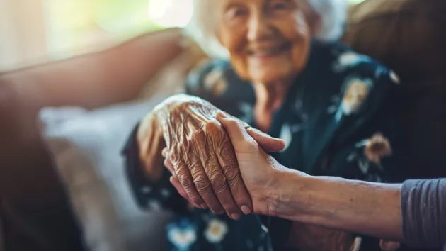 younger helping an older person