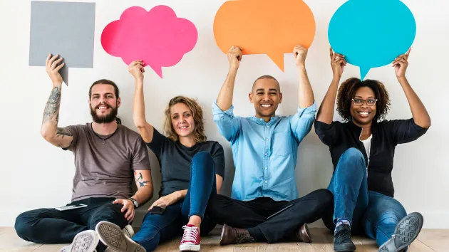 people holding speech bubbles