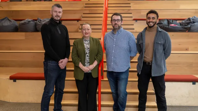 Nisien's Professor Pete Burnap, Lee Gainer and Tyrone Stuart with Economy Secretary Rebecca Evans