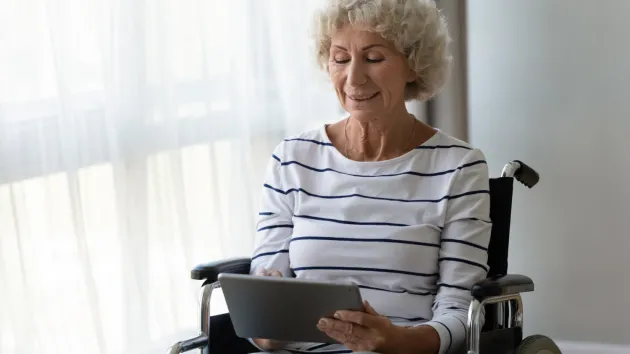 Mature woman using a digital device 
