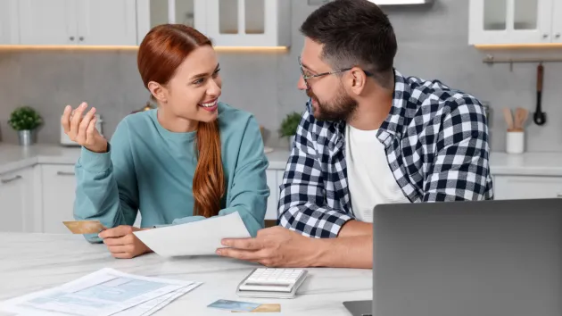 Couple doing their tax return online.