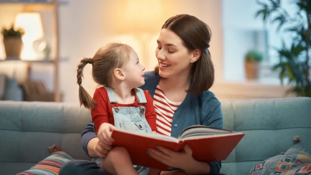 mother reading to her daughter 