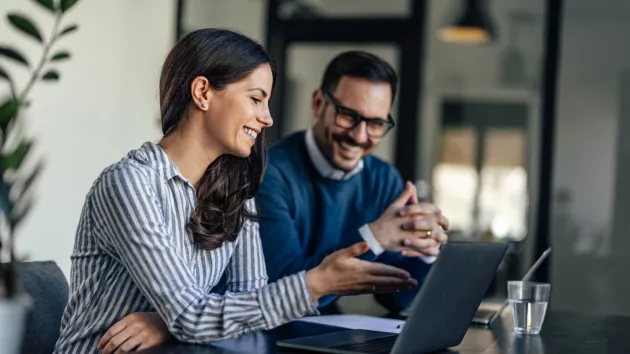 business owners looking at a laptop 