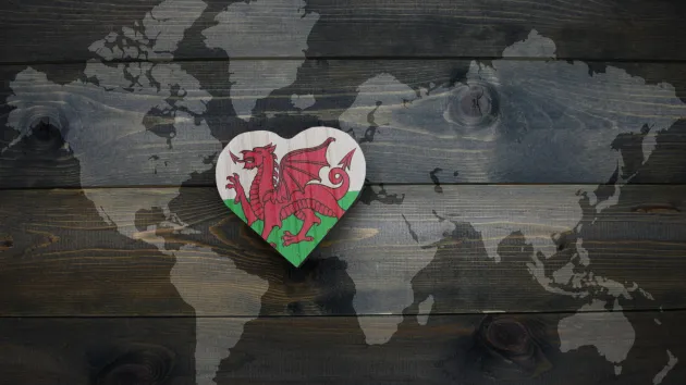 world map with Welsh flag in the shape of a heart