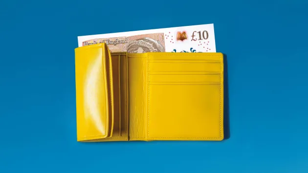 wallet with a £10 note