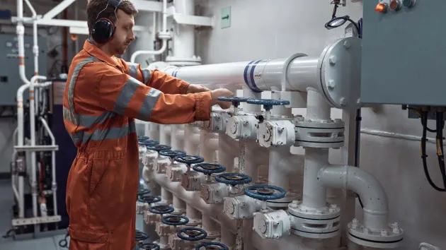 Marine Engineer in boiler room of a ship
