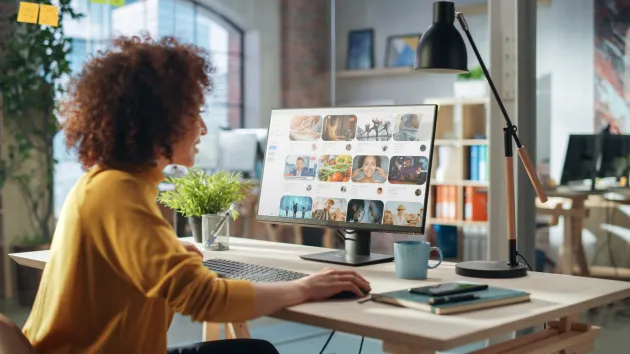 person looking at computer screen - marketing