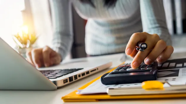 person using a calculator