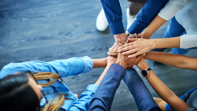 Hands touching - partnership working 