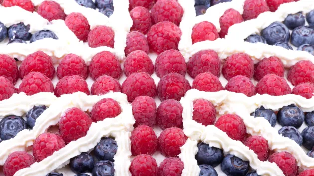 Union Jack flag made out of raspberries, blue berries and cream