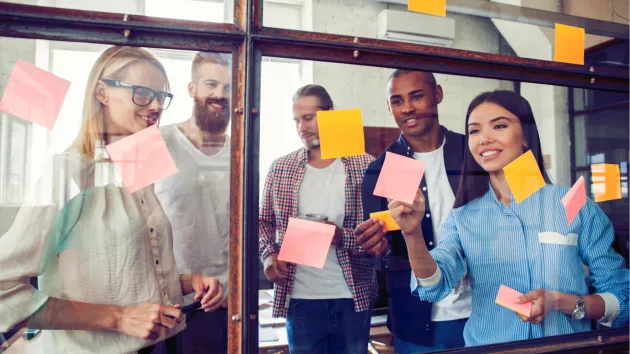 team discussion, sticky notes on a wall