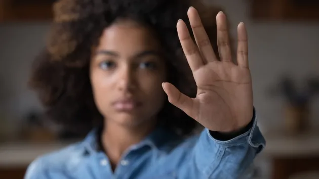 person with their hand up