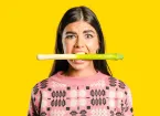 Woman biting a leek
