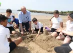 Minister for Rural Resilience and Sustainability, Llyr Gruffydd, meets with schoolchildren in Barry 