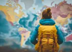 Person stood in front of a map of the world