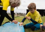 Porthcawl surf school, child on a surfboard