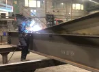 worker using machinery with sparks 
