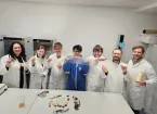 Plantsea staff stand in a line holding up their seaweed based packaging.