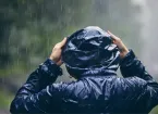 wet weather - person walking in the rain 