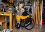 Wheelchair user in  workshop