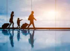family walking through and airport 