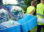 Staff at a festival recycling bottles and cans